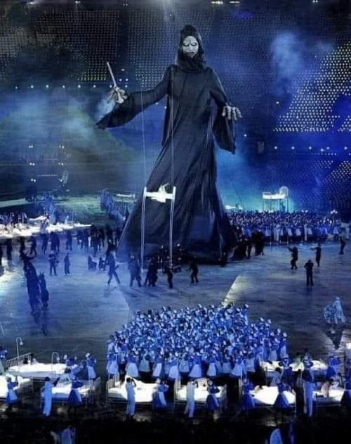 PREDICTIVE PROGRAMMING: The opening ceremony of the  2012 Olympics in London featured a giant figure of death holding a NEEDLE, with doctors and nurses dancing like zombies around children in hospital beds...